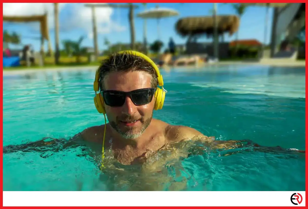 Man wearing headphones in the pool