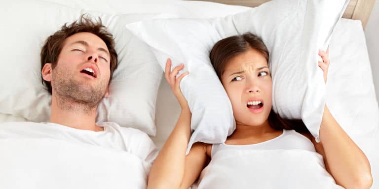 Couple in bed - Snoring man