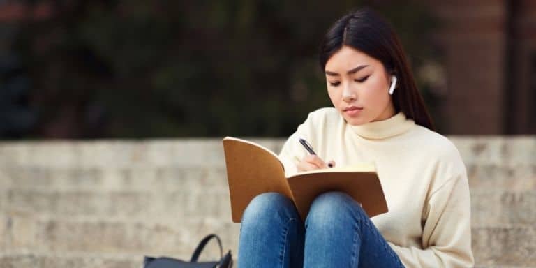 Woman studying with Airpods