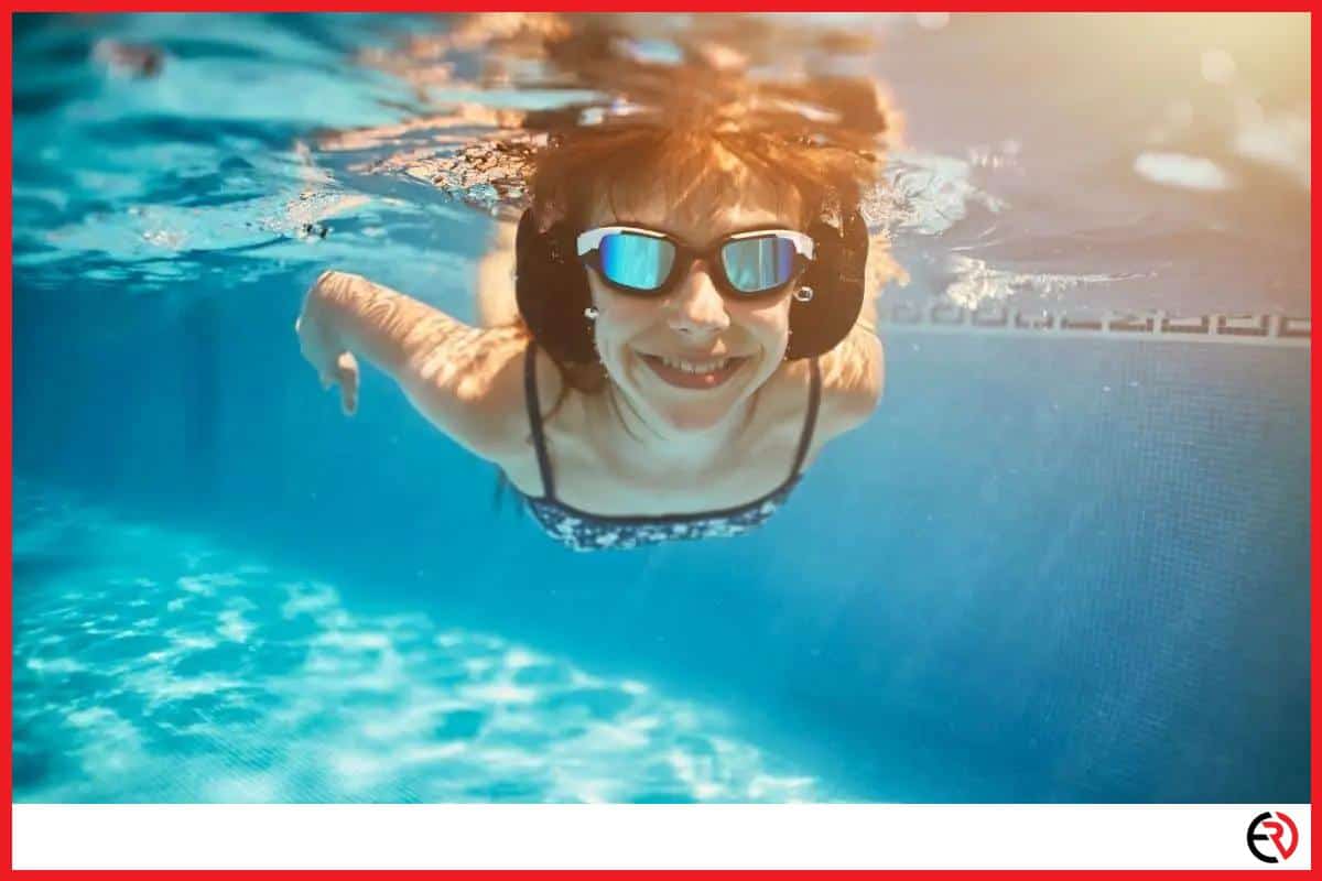 Woman swimming with headphones