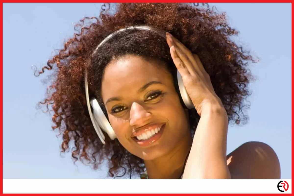 Smiling woman listening to headphones
