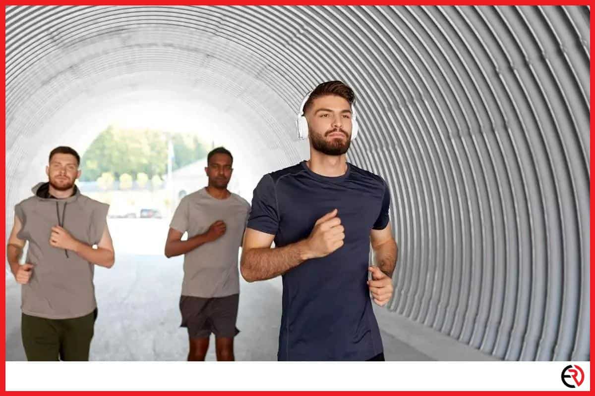 Man running with headphones with his friends