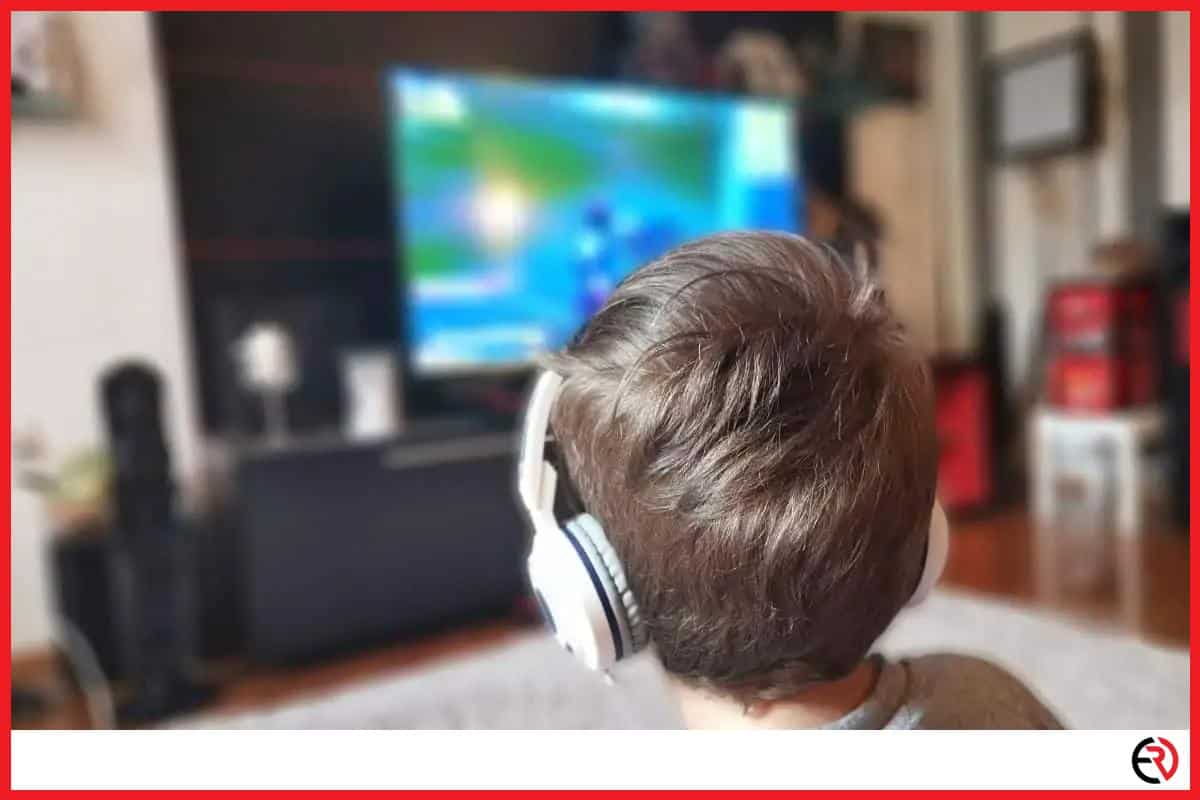Boy watching TV with headphones