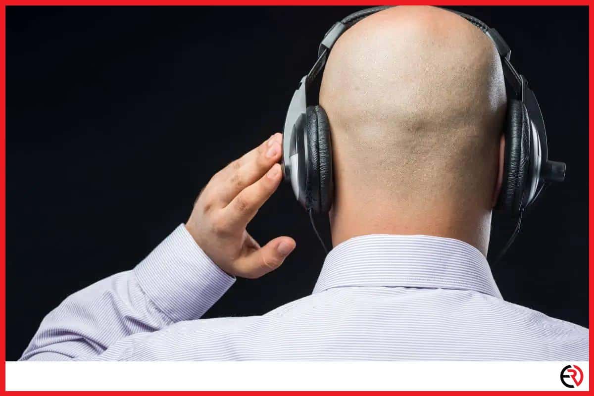 Bald man wearing headphones